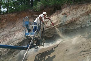 Applying shotcrete to hill side