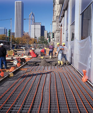 Snow-melt application on a city sidewalk.